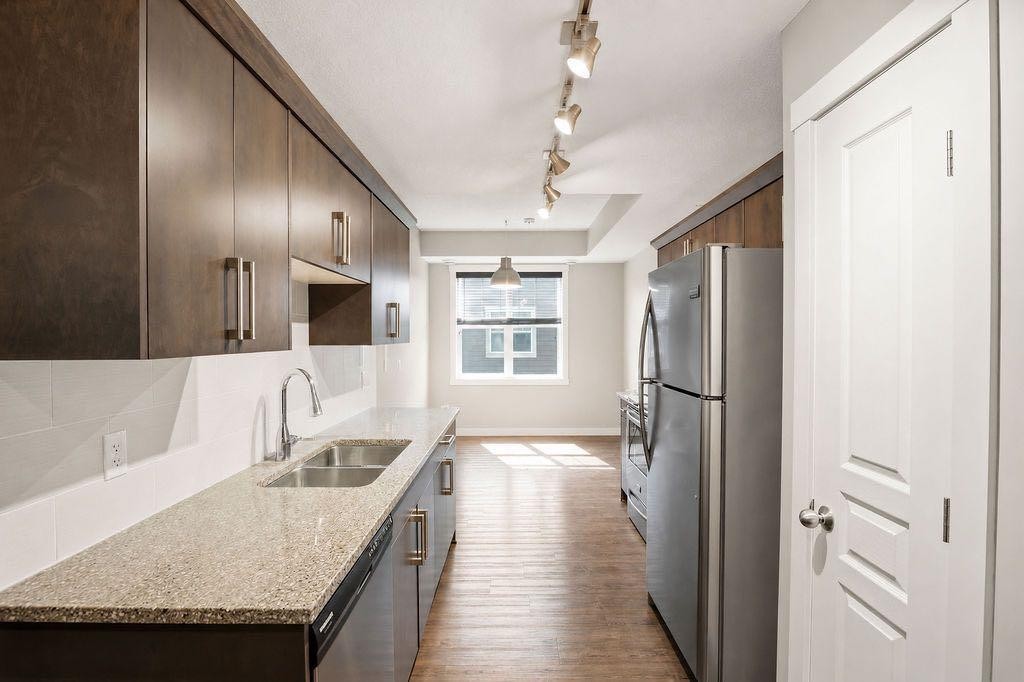 218 Cranford Walk Se, Calgary, AB - Indoor Photo Showing Kitchen With Stainless Steel Kitchen With Double Sink With Upgraded Kitchen