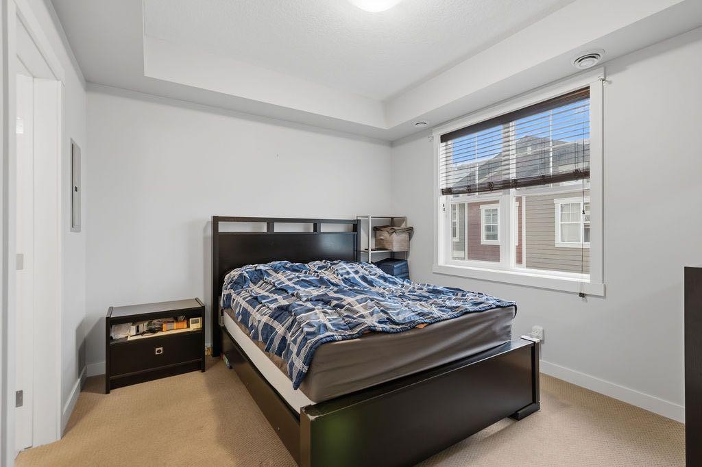 218 Cranford Walk Se, Calgary, AB - Indoor Photo Showing Bedroom
