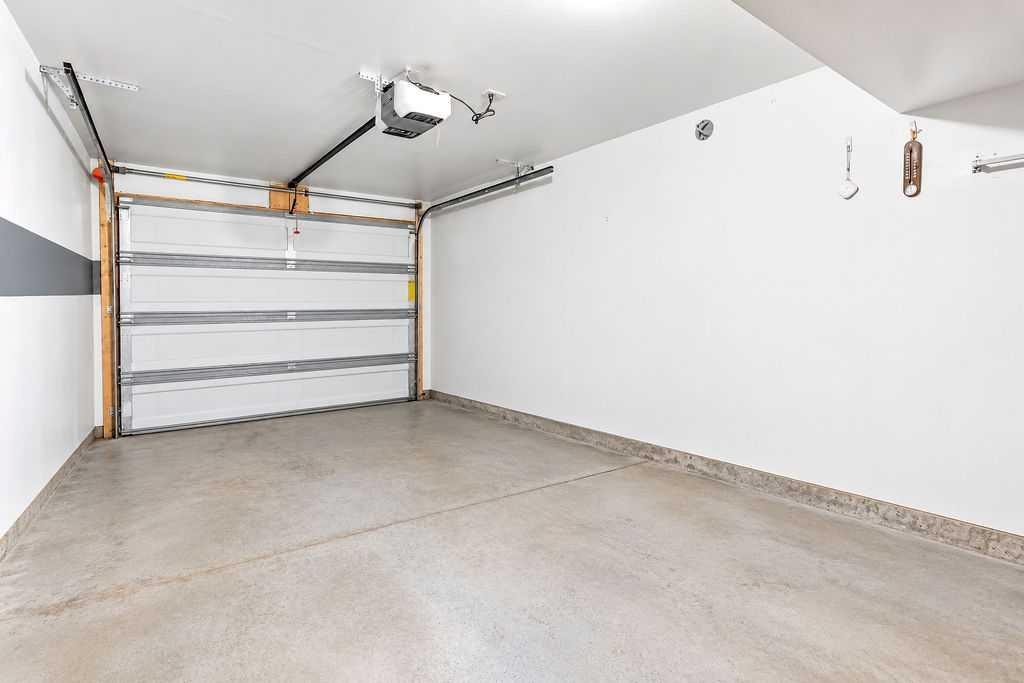 218 Cranford Walk Se, Calgary, AB - Indoor Photo Showing Garage