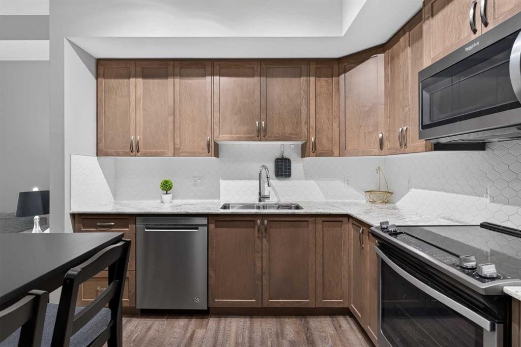 2115-3727 Sage Hill Drive Nw, Calgary, AB - Indoor Photo Showing Kitchen With Stainless Steel Kitchen