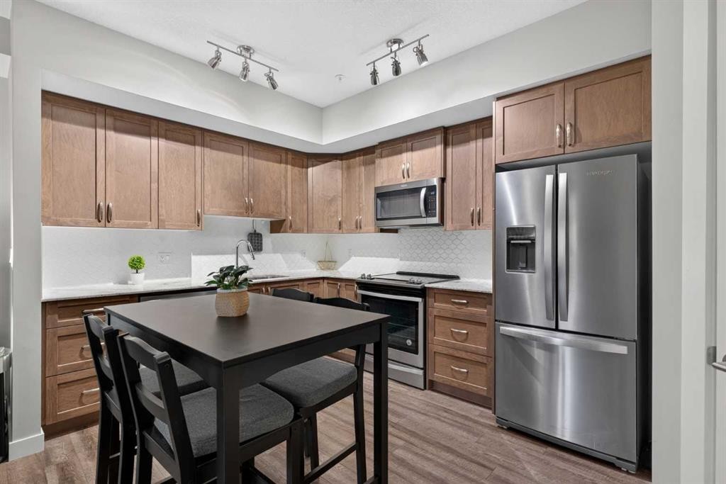 2115-3727 Sage Hill Drive Nw, Calgary, AB - Indoor Photo Showing Kitchen With Stainless Steel Kitchen