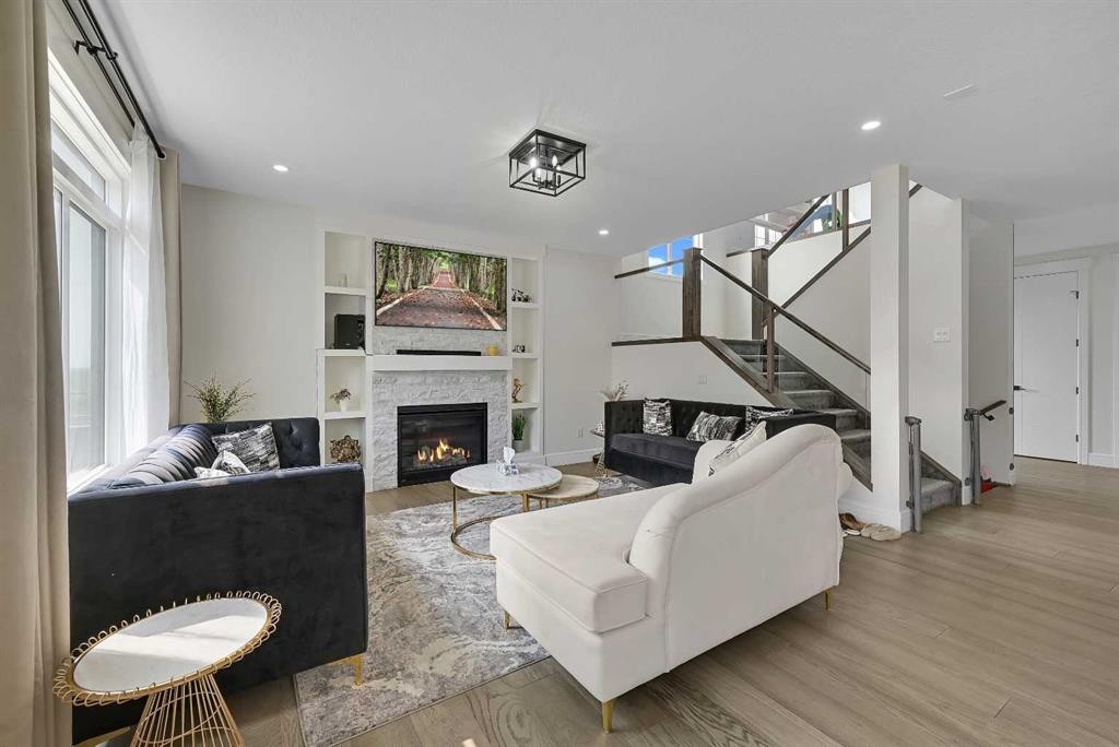 70 South Shore Bay, Chestermere, AB - Indoor Photo Showing Living Room With Fireplace