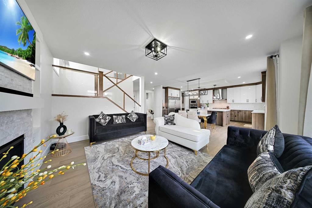 70 South Shore Bay, Chestermere, AB - Indoor Photo Showing Living Room With Fireplace
