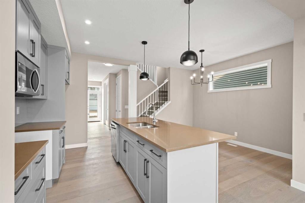 664 Sora Boulevard Se, Calgary, AB - Indoor Photo Showing Kitchen With Double Sink