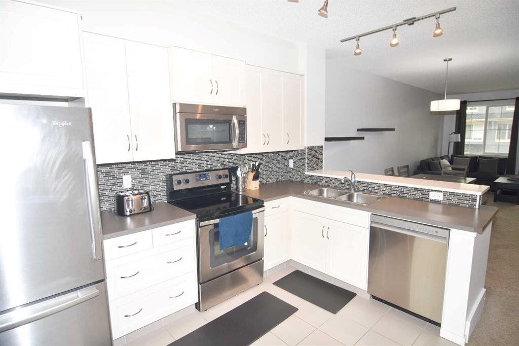 43 Kinlea Common Nw, Calgary, AB - Indoor Photo Showing Kitchen With Stainless Steel Kitchen With Double Sink