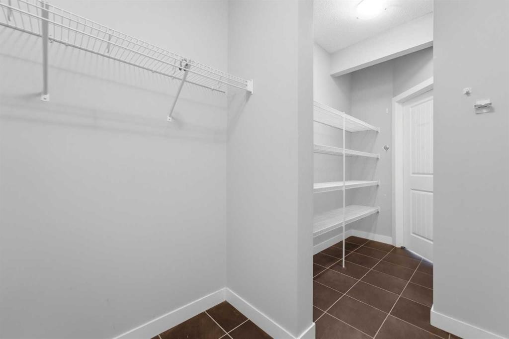 174 Morningside Circle Sw, Airdrie, AB - Indoor With Storage