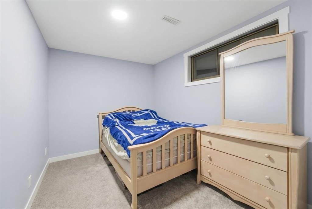 174 Morningside Circle Sw, Airdrie, AB - Indoor Photo Showing Bedroom