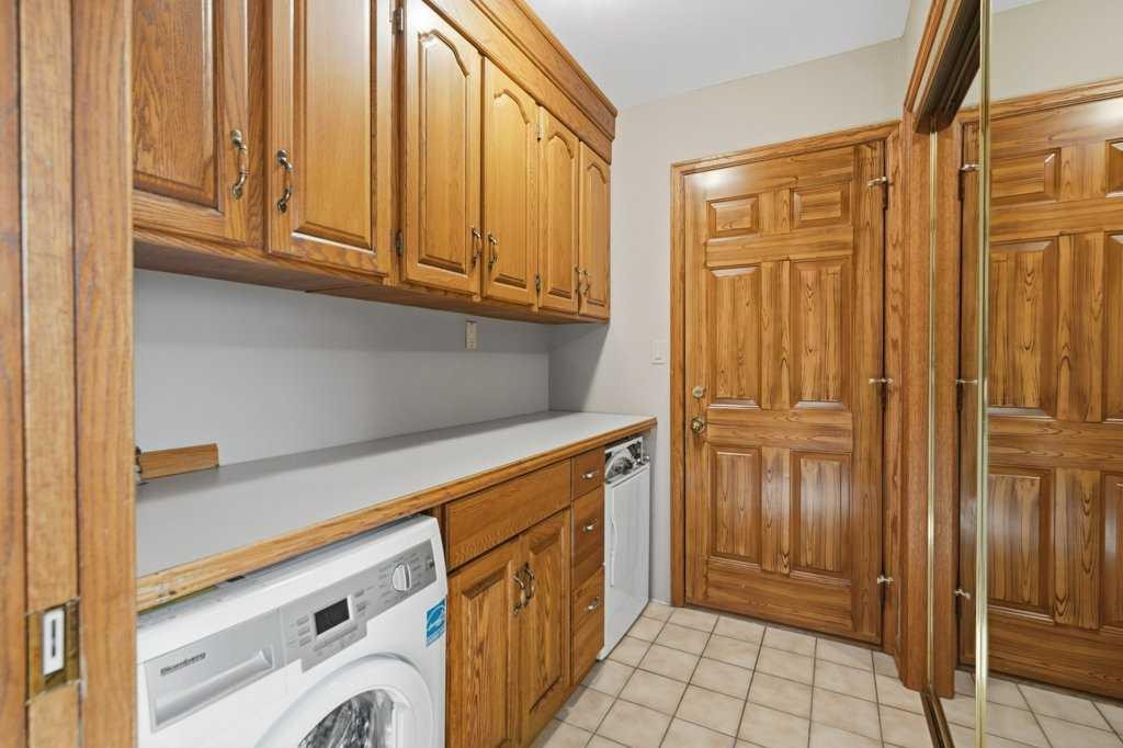 119 Strathbury Bay Sw, Calgary, AB - Indoor Photo Showing Laundry Room