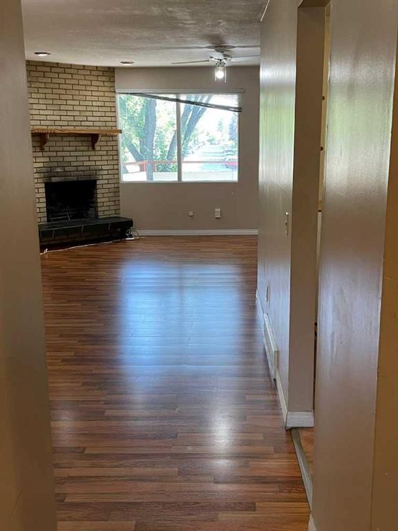 4222 40 Avenue Nw, Calgary, AB - Indoor Photo Showing Other Room With Fireplace
