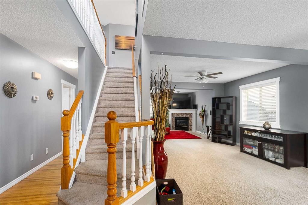 224 Arbour Ridge Way Nw, Calgary, AB - Indoor Photo Showing Other Room With Fireplace
