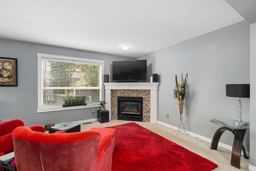 224 Arbour Ridge Way Nw, Calgary, AB - Indoor Photo Showing Living Room With Fireplace