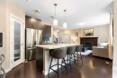 165 Cranarch Common Se, Calgary, AB  - Indoor Photo Showing Kitchen With Fireplace With Upgraded Kitchen 