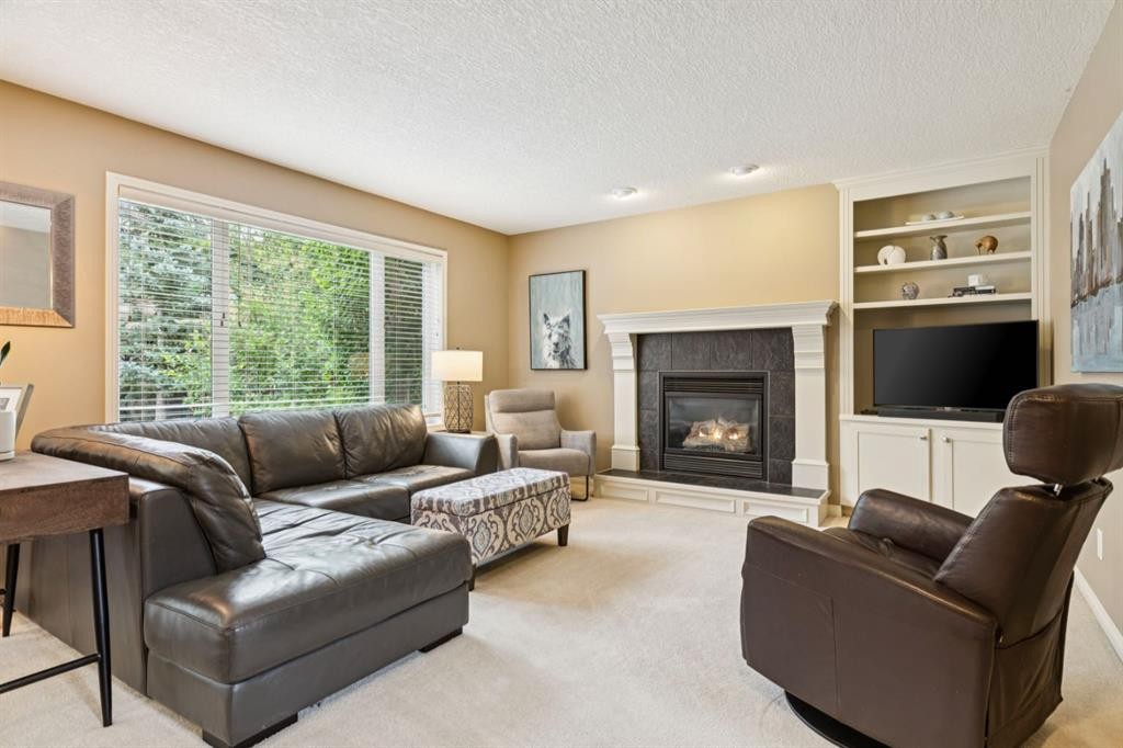51 Sienna Park Crescent Sw, Calgary, AB - Indoor Photo Showing Living Room With Fireplace