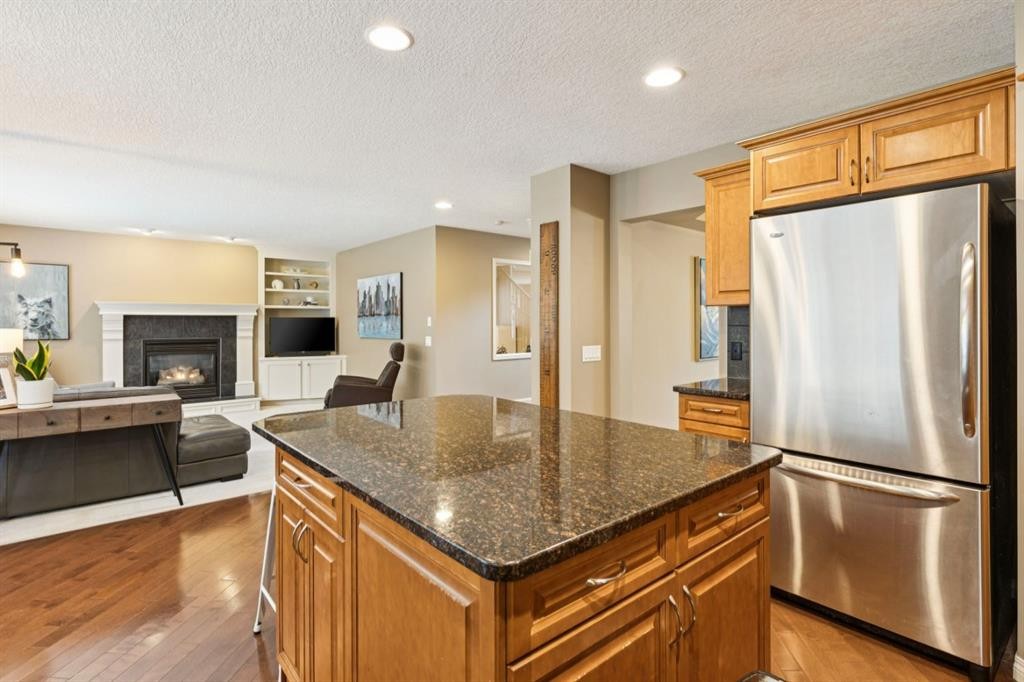 51 Sienna Park Crescent Sw, Calgary, AB - Indoor Photo Showing Kitchen With Fireplace