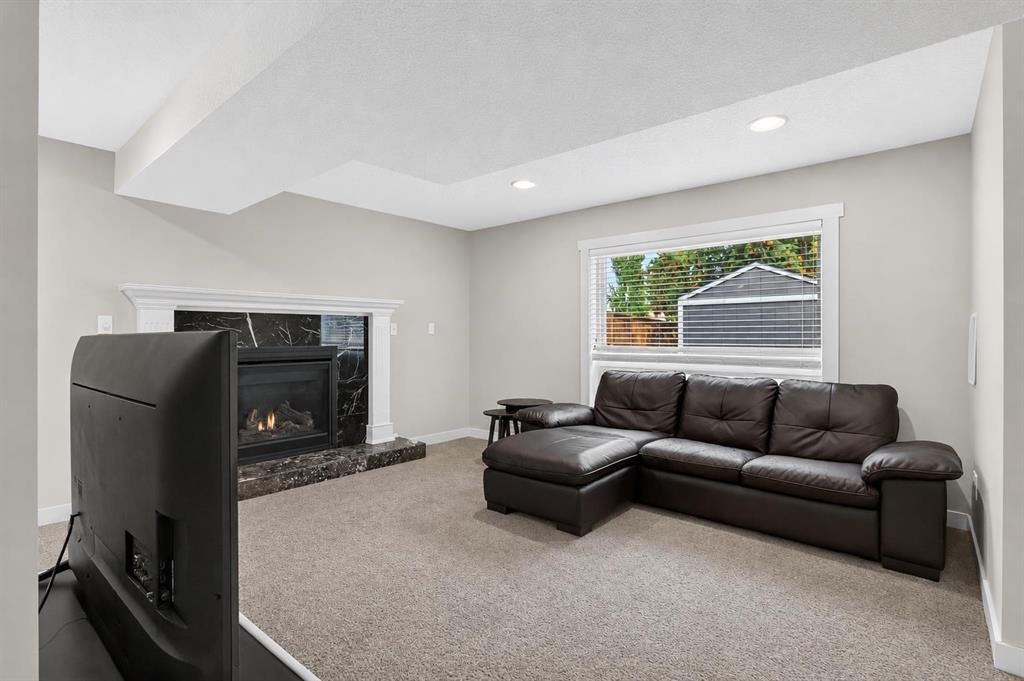 2888 Signal Hill Drive Sw, Calgary, AB - Indoor Photo Showing Living Room With Fireplace