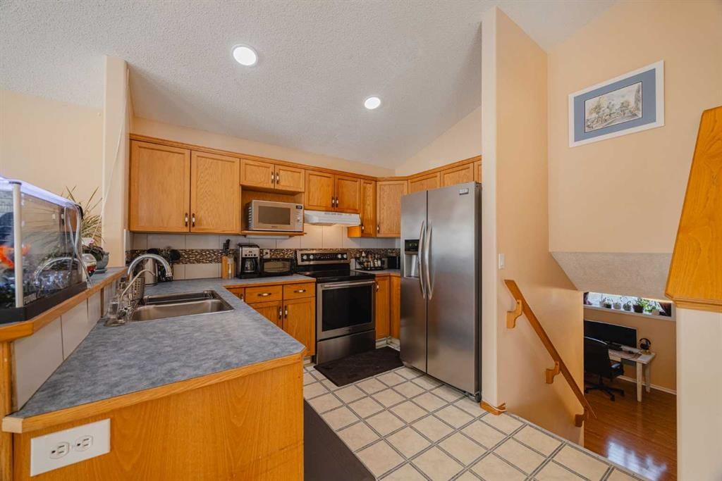 23 Tarington Way Ne, Calgary, AB - Indoor Photo Showing Kitchen With Double Sink