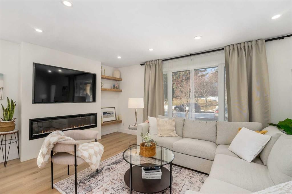 824 Canna Crescent Sw, Calgary, AB - Indoor Photo Showing Living Room With Fireplace