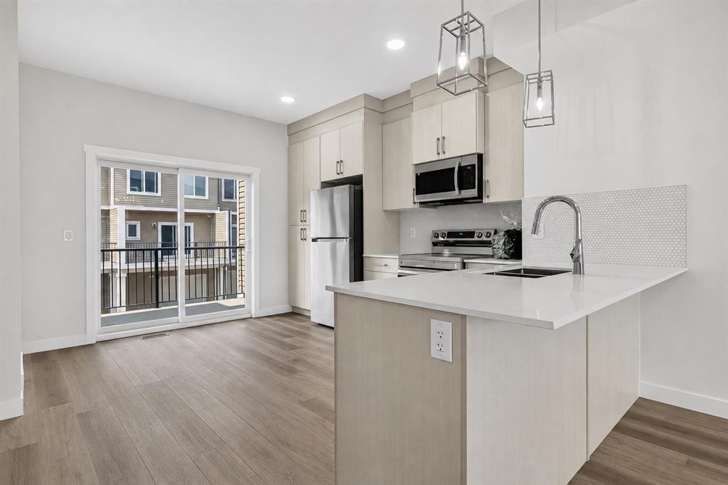 207-75 Cornerstone Row Ne, Calgary, AB - Indoor Photo Showing Kitchen With Double Sink With Upgraded Kitchen