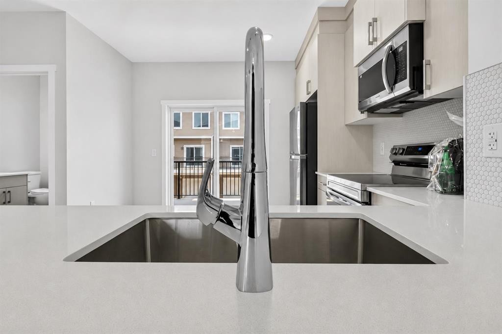 207-75 Cornerstone Row Ne, Calgary, AB - Indoor Photo Showing Kitchen With Double Sink