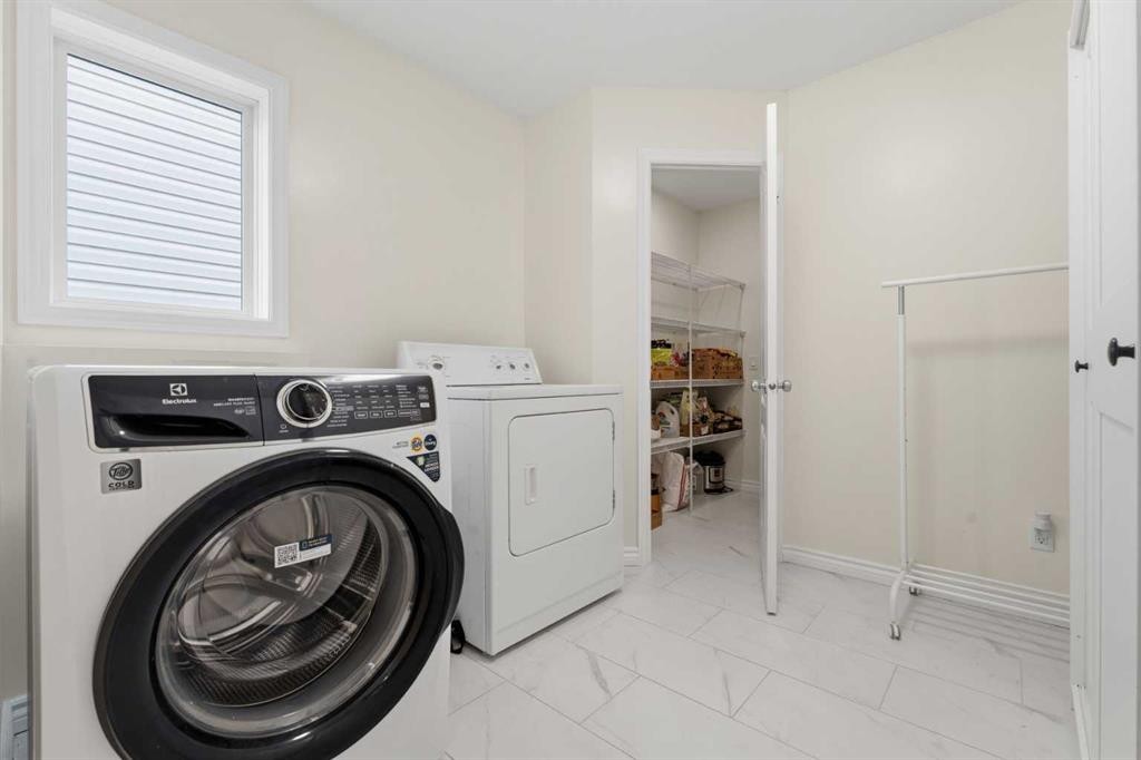 50 Somerglen Park Sw, Calgary, AB - Indoor Photo Showing Laundry Room
