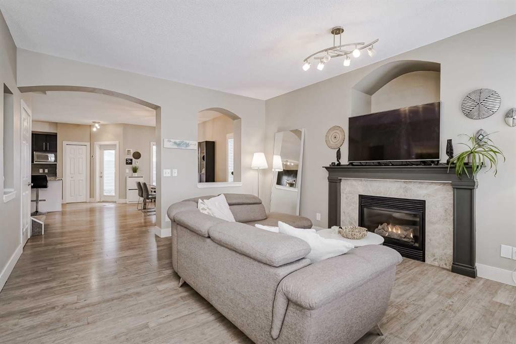 260 Chaparral Ridge Circle Se, Calgary, AB - Indoor Photo Showing Living Room With Fireplace