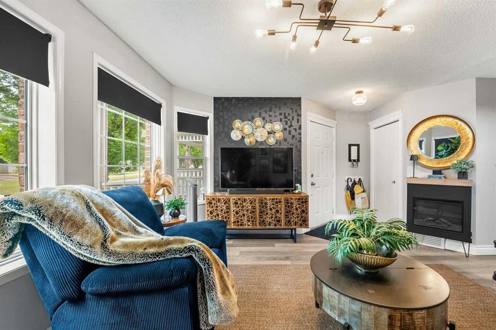 39 Hidden Valley Link Nw, Calgary, AB - Indoor Photo Showing Living Room With Fireplace