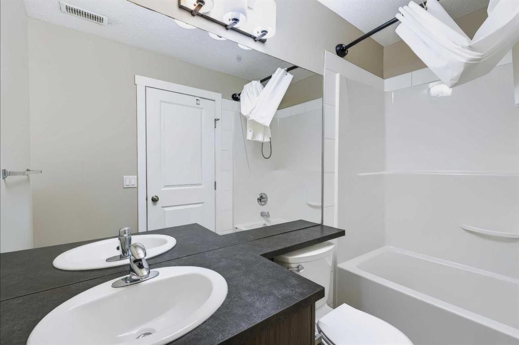 210-300 Marina Drive, Chestermere, AB - Indoor Photo Showing Bathroom