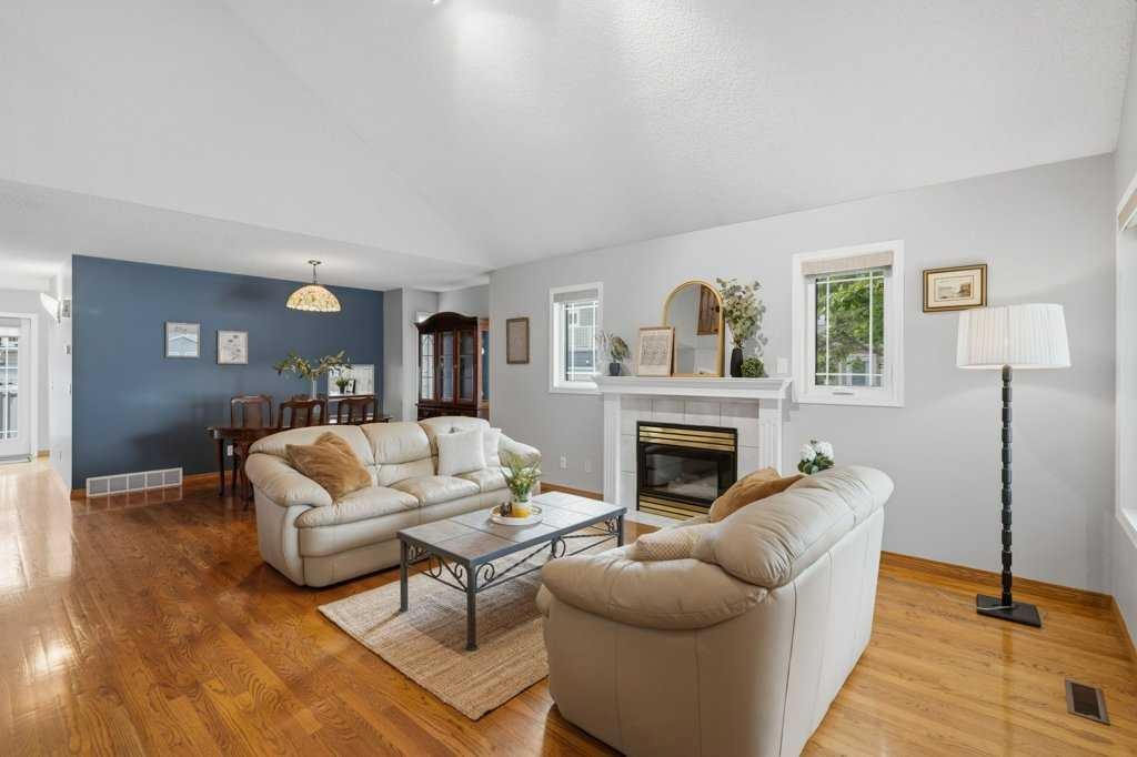 4 Inglewood Landing Se, Calgary, AB - Indoor Photo Showing Living Room With Fireplace
