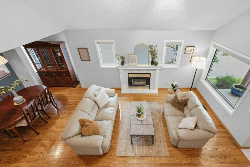 4 Inglewood Landing Se, Calgary, AB - Indoor Photo Showing Living Room With Fireplace
