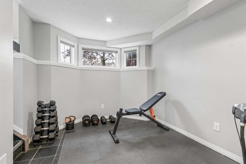 230 Mt Lorette Place Se, Calgary, AB - Indoor Photo Showing Gym Room