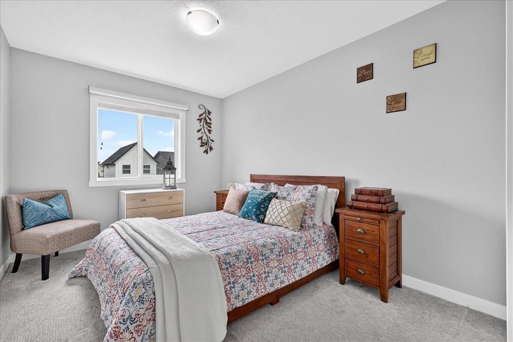 163 Copperleaf Way Se, Calgary, AB - Indoor Photo Showing Bedroom