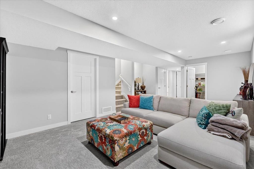163 Copperleaf Way Se, Calgary, AB - Indoor Photo Showing Living Room