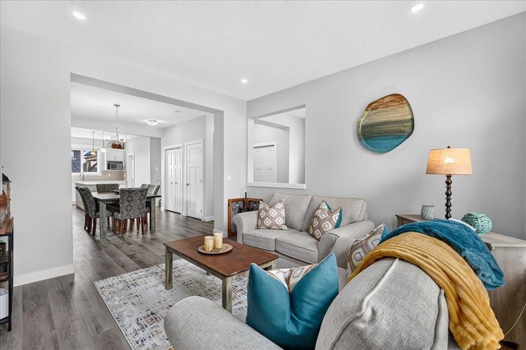 163 Copperleaf Way Se, Calgary, AB - Indoor Photo Showing Living Room