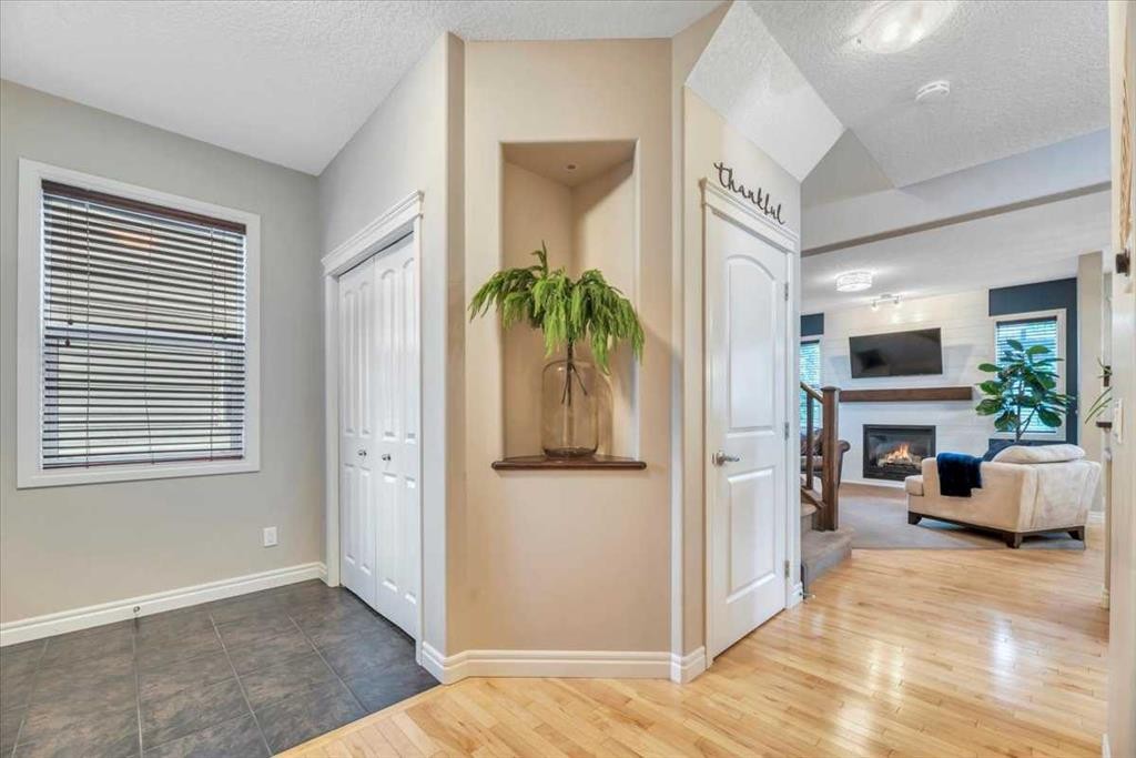 13 Cranberry Avenue Se, Calgary, AB - Indoor Photo Showing Other Room With Fireplace