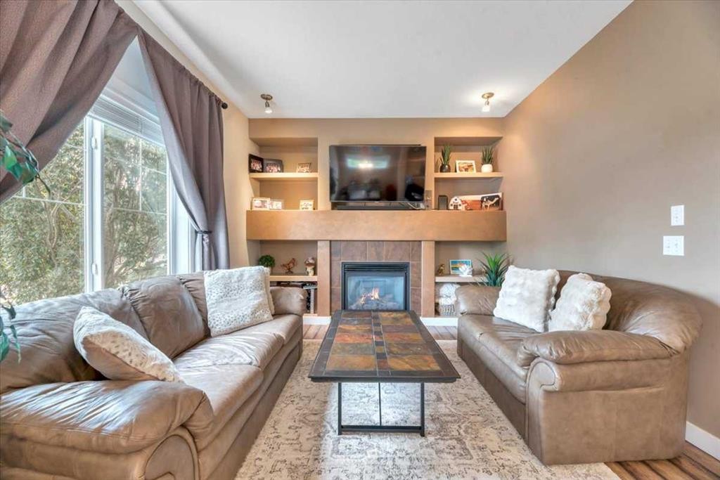331 Ranch Ridge Meadow, Strathmore, AB - Indoor Photo Showing Living Room With Fireplace