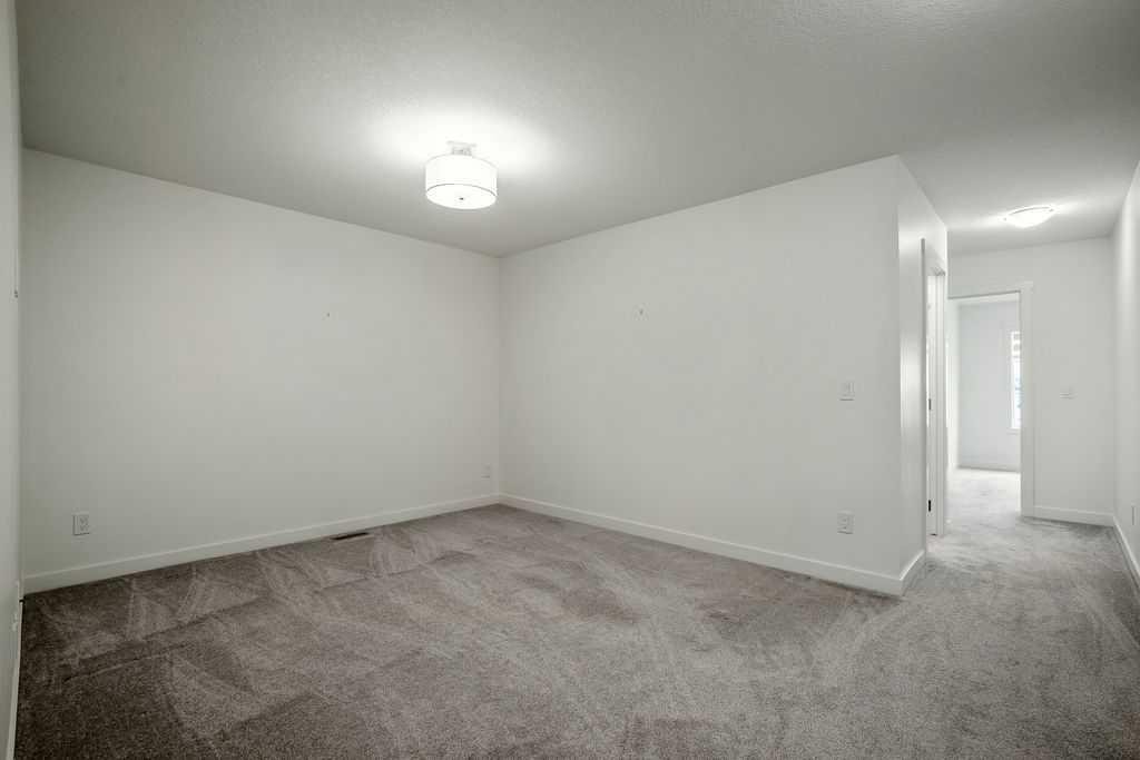 882 Bluerock Way Sw, Calgary, AB - Indoor Photo Showing Other Room
