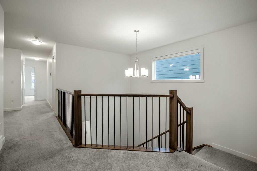 882 Bluerock Way Sw, Calgary, AB - Indoor Photo Showing Other Room