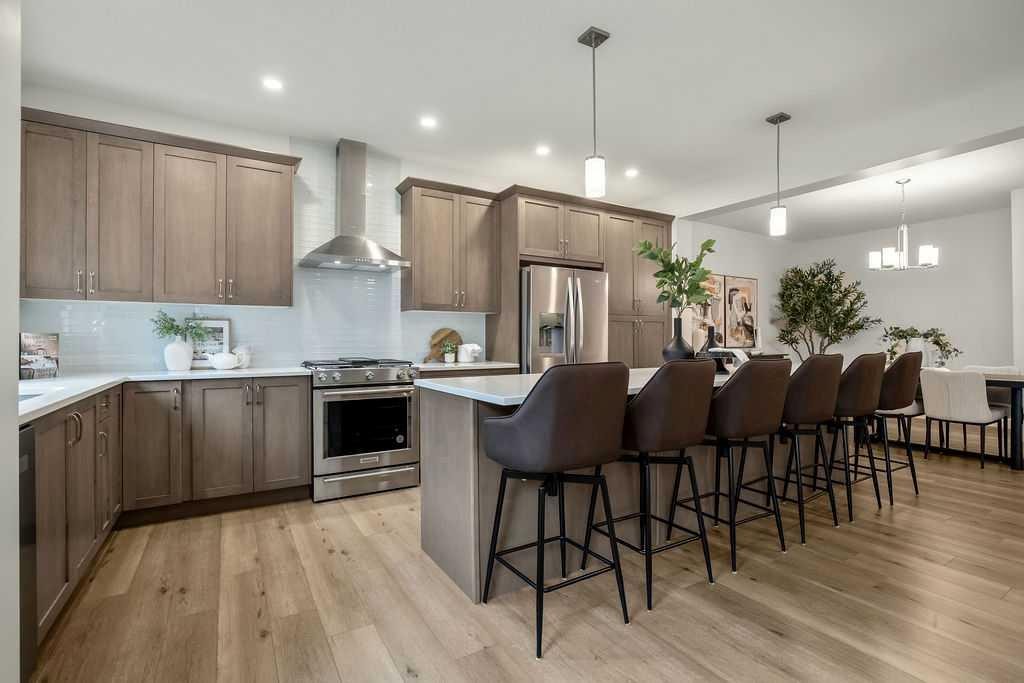 882 Bluerock Way Sw, Calgary, AB - Indoor Photo Showing Kitchen With Upgraded Kitchen