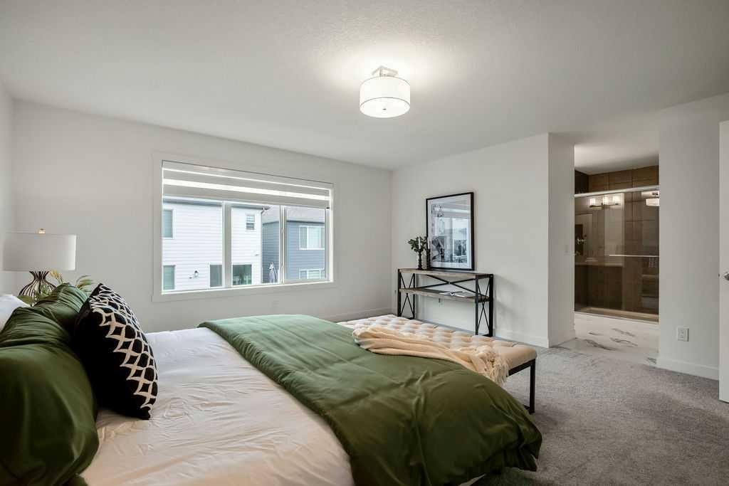 882 Bluerock Way Sw, Calgary, AB - Indoor Photo Showing Bedroom