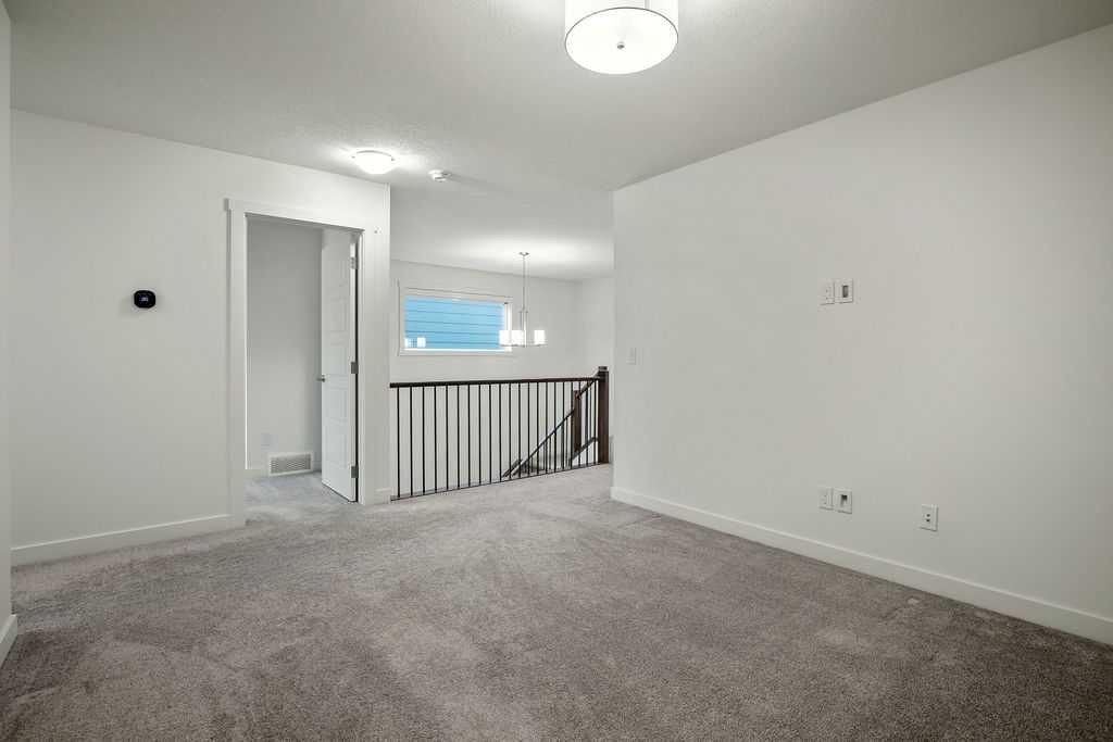882 Bluerock Way Sw, Calgary, AB - Indoor Photo Showing Other Room