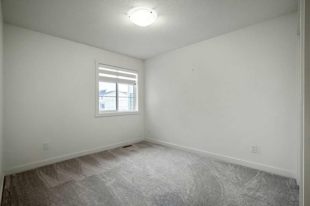 882 Bluerock Way Sw, Calgary, AB - Indoor Photo Showing Other Room