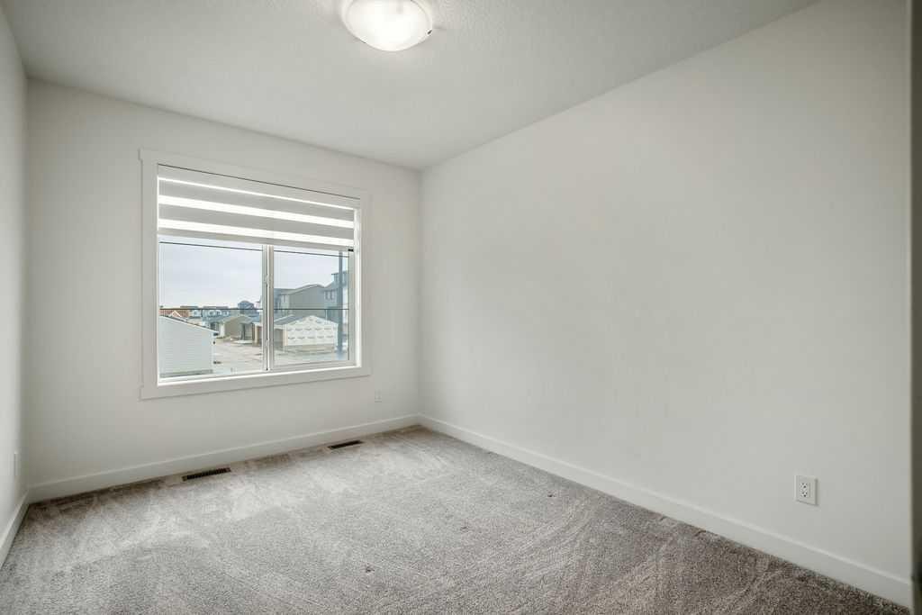 882 Bluerock Way Sw, Calgary, AB - Indoor Photo Showing Other Room