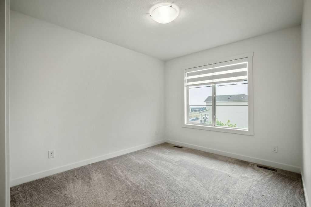 882 Bluerock Way Sw, Calgary, AB - Indoor Photo Showing Other Room