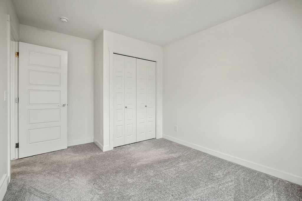882 Bluerock Way Sw, Calgary, AB - Indoor Photo Showing Other Room