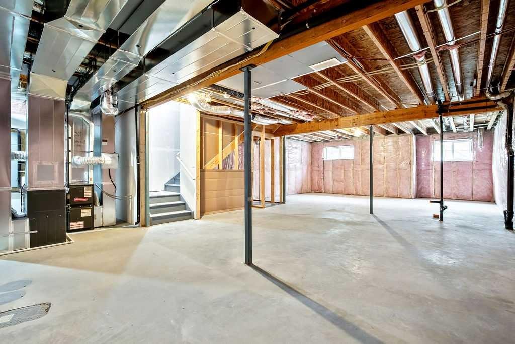 882 Bluerock Way Sw, Calgary, AB - Indoor Photo Showing Basement