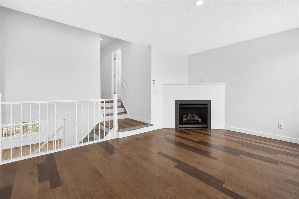 133 Martinvalley Crescent Ne, Calgary, AB - Indoor Photo Showing Living Room With Fireplace