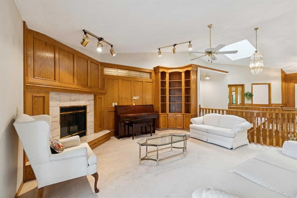 116 Scandia Rise Nw, Calgary, AB - Indoor Photo Showing Living Room With Fireplace