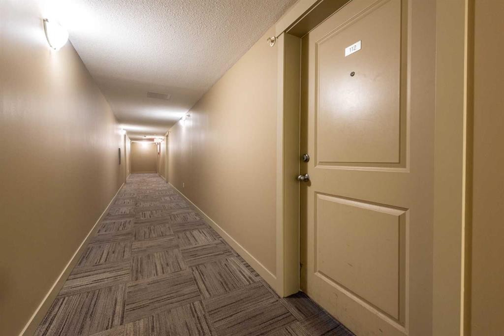 8112-403 Mackenzie Way Se, Airdrie, AB - Indoor Photo Showing Other Room