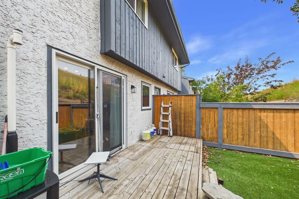 24-800 Bowcroft Place, Cochrane, AB - Outdoor With Deck Patio Veranda With Exterior