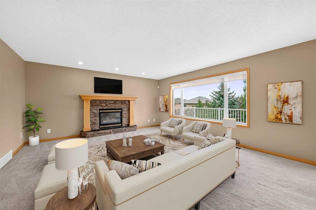 78 Hampstead View Nw, Calgary, AB - Indoor Photo Showing Living Room With Fireplace